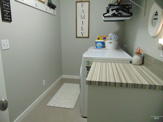 983 S St, Vale, OR 97918 - washroom featuring washing machine and clothes dryer and baseboards