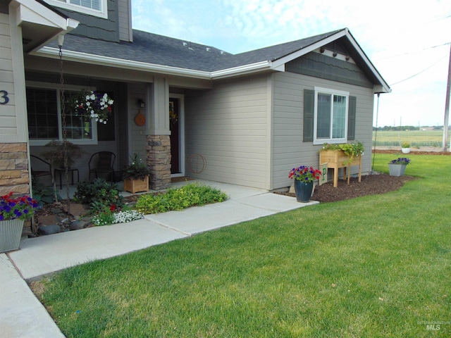 983 S St, Vale, OR 97918 - property entrance with a yard and roof with shingles