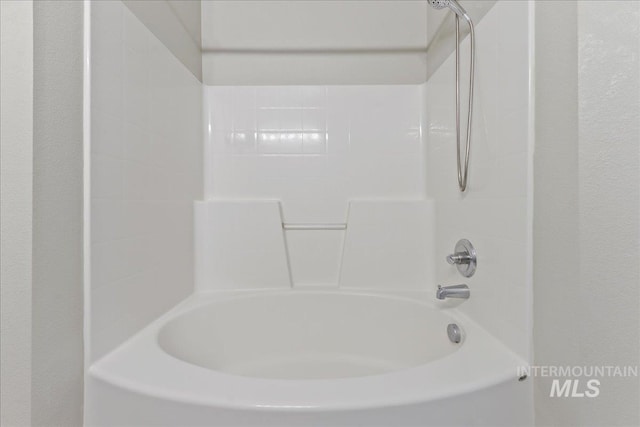 bathroom featuring  shower combination