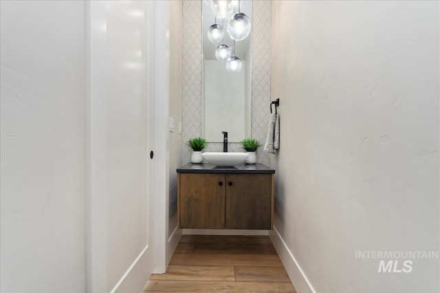 bathroom with vanity and wood-type flooring