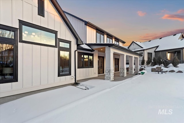 view of snow covered house