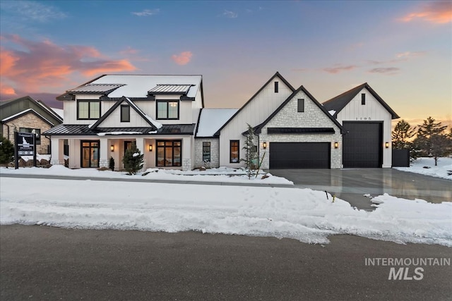 modern farmhouse featuring a garage