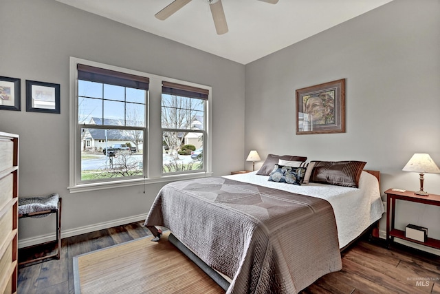 bedroom with hardwood / wood-style flooring and ceiling fan