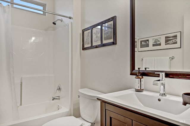 full bathroom with shower / bathtub combination with curtain, vanity, and toilet