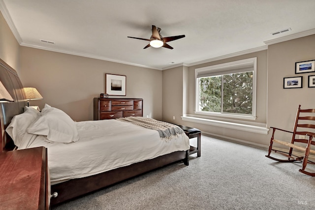 bedroom featuring crown molding, carpet, and ceiling fan