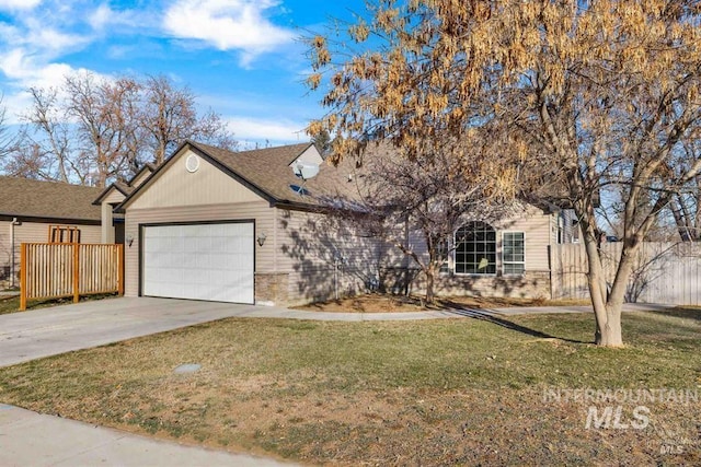 view of front of property with a garage and a front yard