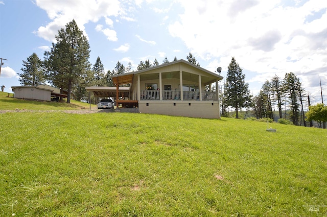 128SHENANDOAH 2nd St, Kamiah, ID 83536 - rear view of house with a carport, a lawn, and driveway