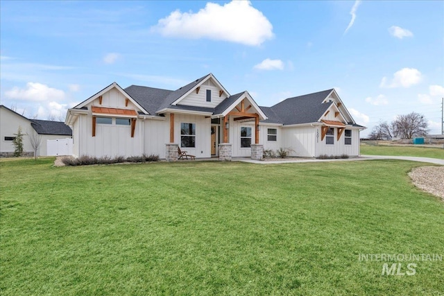 view of front of house featuring board and batten siding and a front yard