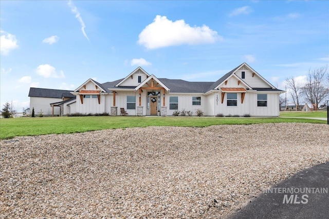 modern farmhouse style home with board and batten siding and a front yard