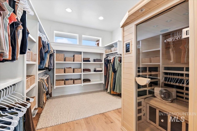 spacious closet with wood finished floors