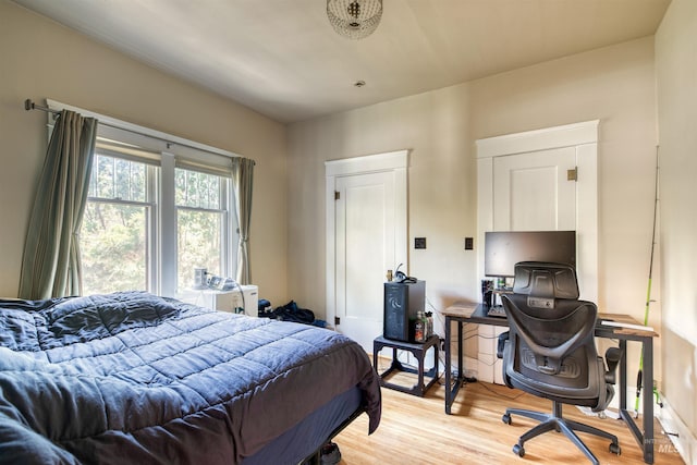 bedroom featuring light wood finished floors