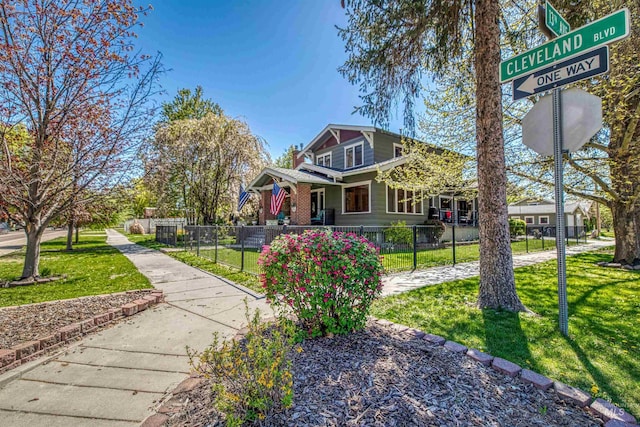 view of front of property with a fenced front yard and a front yard