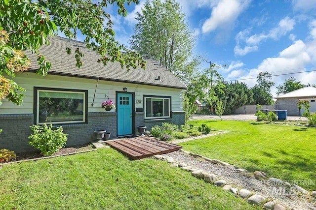 1315 E Lincoln Ave, Nampa, ID 83686 - rear view of house with brick siding and a yard