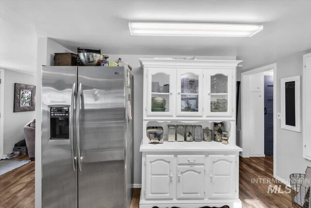 1315 E Lincoln Ave, Nampa, ID 83686 - kitchen featuring stainless steel refrigerator with ice dispenser, white cabinets, glass insert cabinets, wood finished floors, and light countertops