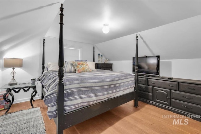 1315 E Lincoln Ave, Nampa, ID 83686 - bedroom featuring lofted ceiling and light wood-style floors