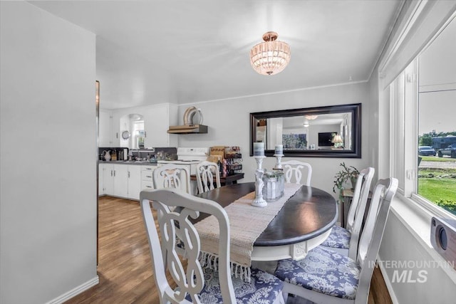 1315 E Lincoln Ave, Nampa, ID 83686 - dining space with wood finished floors and a chandelier