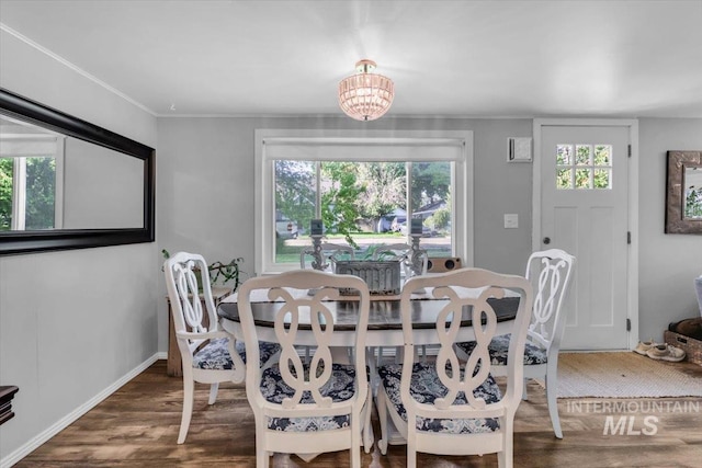 1315 E Lincoln Ave, Nampa, ID 83686 - dining room featuring wood finished floors, a chandelier, and baseboards
