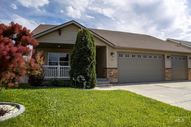 1155 Caswell Ave W, Twin Falls, ID 83301 - view of front of house featuring an attached garage, concrete driveway, a front yard, stone siding, and a shingled roof