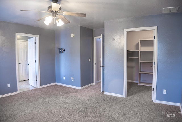 1155 Caswell Ave W, Twin Falls, ID 83301 - unfurnished bedroom with a spacious closet, carpet, a closet, and a ceiling fan