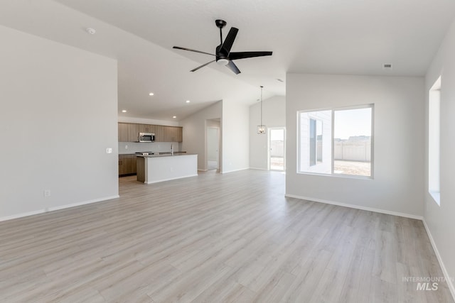 unfurnished living room with ceiling fan, baseboards, light wood-type flooring, lofted ceiling, and recessed lighting