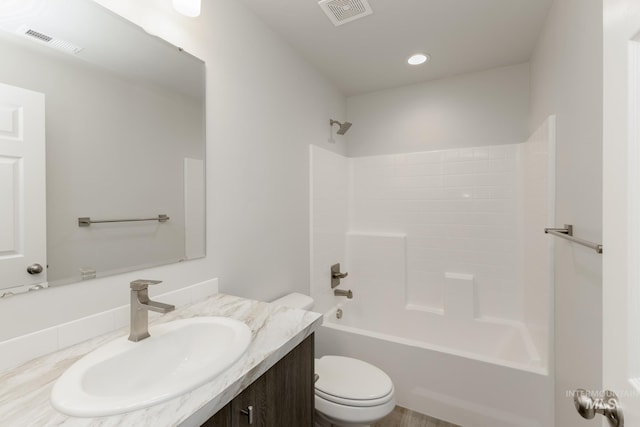 bathroom with shower / bath combination, visible vents, toilet, and vanity