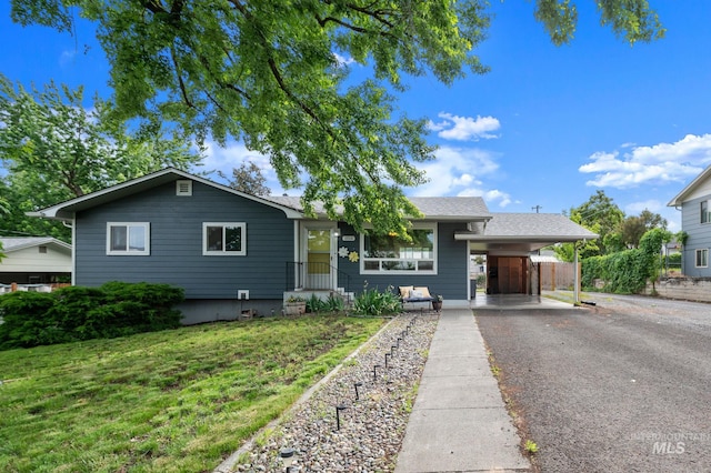 1713 12th St, Lewiston, ID 83501 - view of front of property with asphalt driveway and a carport