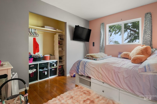 1713 12th St, Lewiston, ID 83501 - bedroom featuring wood finished floors, a closet, and baseboards