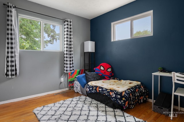 1713 12th St, Lewiston, ID 83501 - bedroom with wood finished floors and baseboards