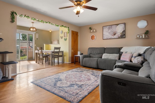 1713 12th St, Lewiston, ID 83501 - living area featuring ceiling fan, wood finished floors, and baseboards