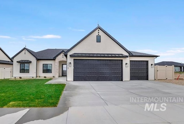 2215 Kooskia Loop, Twin Falls, ID 83301 - view of front facade with a garage, driveway, and stucco siding