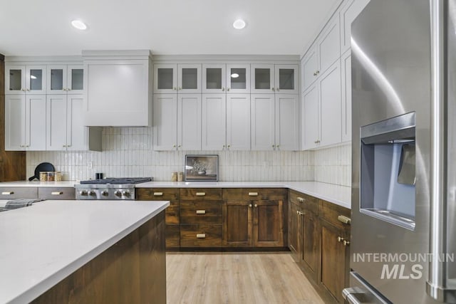 2215 Kooskia Loop, Twin Falls, ID 83301 - kitchen featuring stainless steel refrigerator with ice dispenser, light countertops, backsplash, light wood-style flooring, and recessed lighting