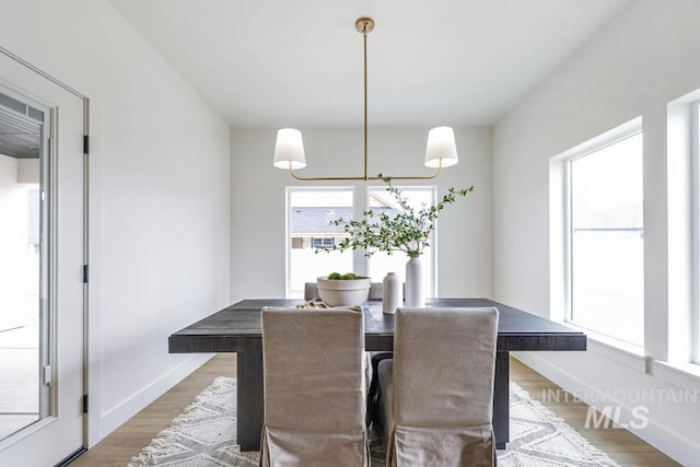 2215 Kooskia Loop, Twin Falls, ID 83301 - dining area with a chandelier and wood finished floors