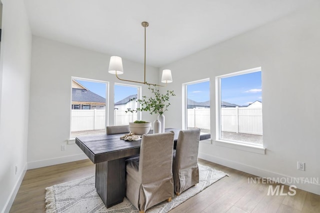 2215 Kooskia Loop, Twin Falls, ID 83301 - dining room featuring healthy amount of natural light and wood finished floors