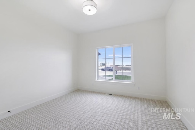 2215 Kooskia Loop, Twin Falls, ID 83301 - spare room featuring carpet floors and baseboards