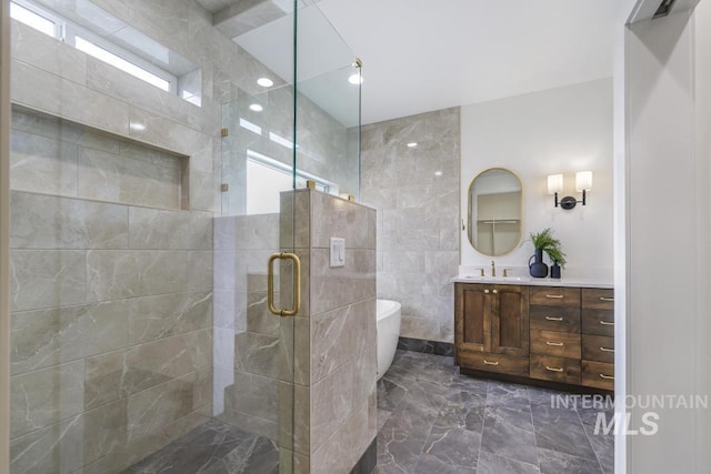 2215 Kooskia Loop, Twin Falls, ID 83301 - bathroom featuring marble tiled floors, vanity, a shower stall, and a freestanding tub