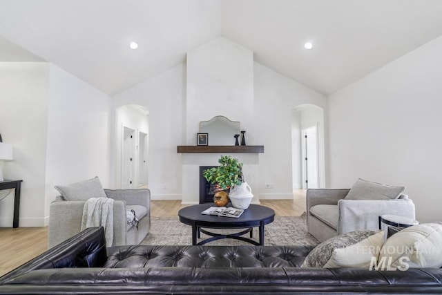 2215 Kooskia Loop, Twin Falls, ID 83301 - living room with arched walkways, high vaulted ceiling, wood finished floors, and recessed lighting