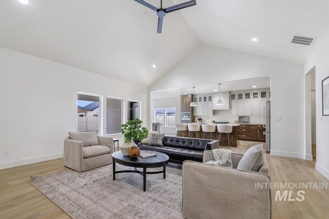 2215 Kooskia Loop, Twin Falls, ID 83301 - living room featuring ceiling fan, light wood finished floors, high vaulted ceiling, and recessed lighting