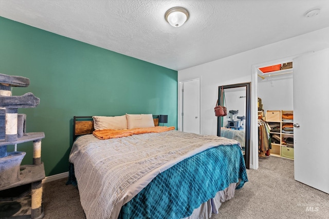 3004 Sandstone Pl, Caldwell, ID 83605 - bedroom with carpet floors, a spacious closet, a closet, and a textured ceiling