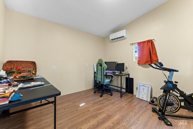 3004 Sandstone Pl, Caldwell, ID 83605 - home office with an AC wall unit, lofted ceiling, and wood finished floors
