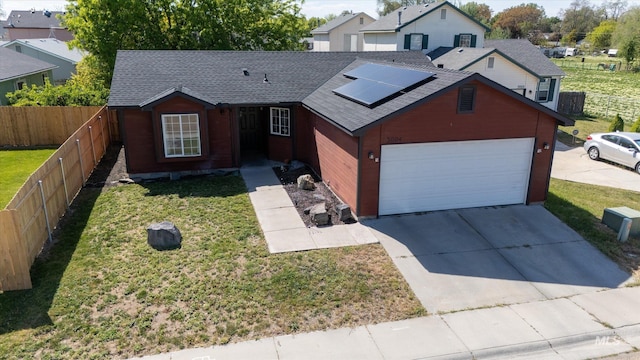 3004 Sandstone Pl, Caldwell, ID 83605 - view of front facade with roof mounted solar panels, concrete driveway, a shingled roof, and an attached garage