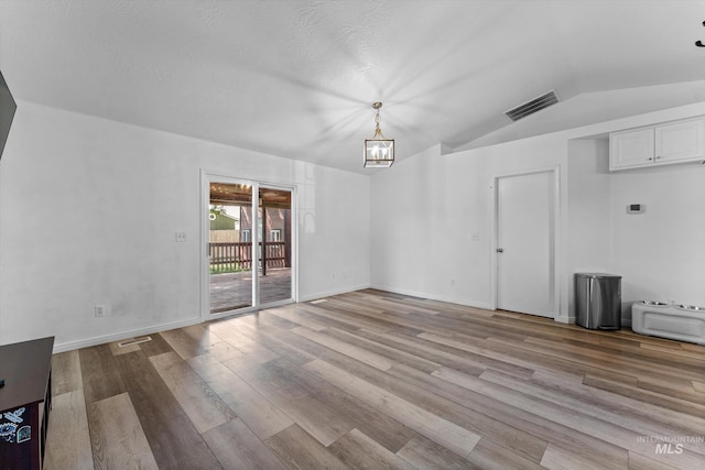 3004 Sandstone Pl, Caldwell, ID 83605 - unfurnished dining area with wood finished floors, lofted ceiling, and baseboards