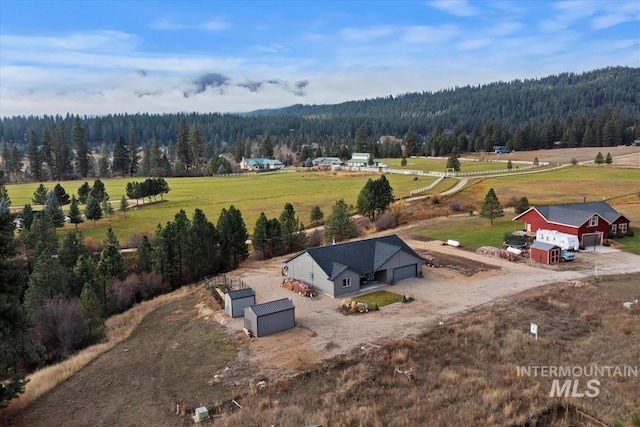 aerial view with a rural view and a view of trees