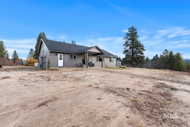 view of front of property featuring fence