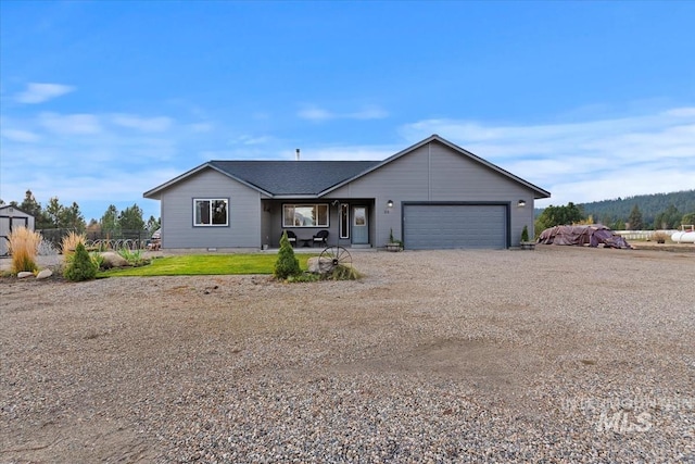 view of front of home featuring driveway and an attached garage