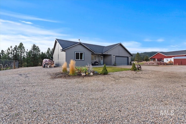 ranch-style house with driveway and an attached garage