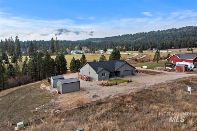 drone / aerial view with a rural view and a forest view