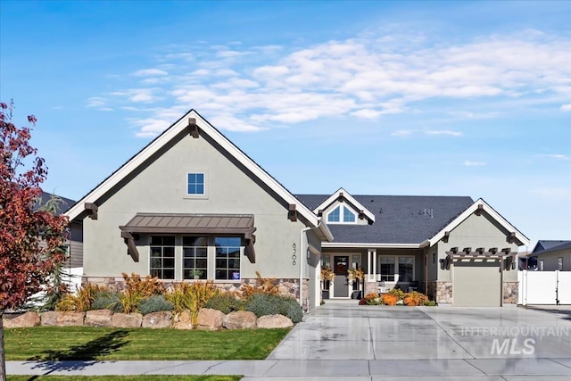 view of front of property with a garage and a porch