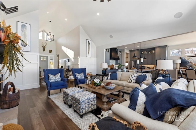 living room featuring vaulted ceiling and dark hardwood / wood-style floors