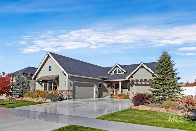 view of front of house with covered porch and a garage