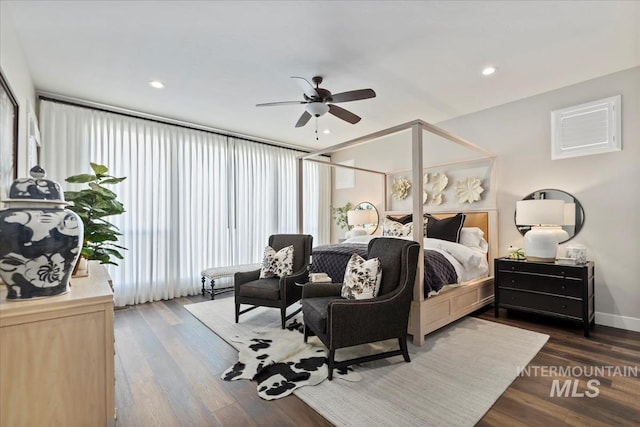 bedroom featuring ceiling fan and dark wood-type flooring